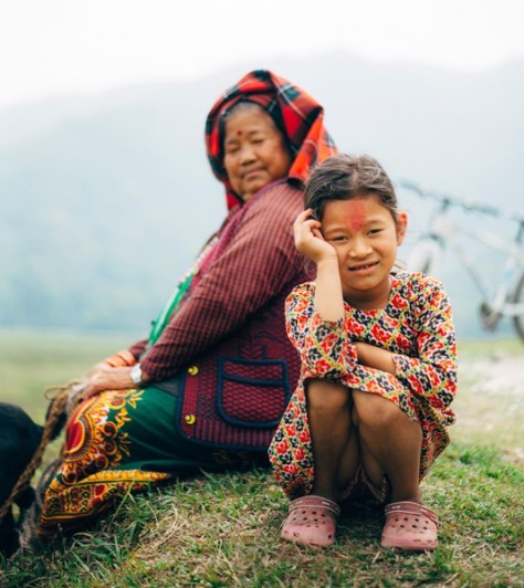 Herd lady and child in Pokhara valley, travel to Nepal