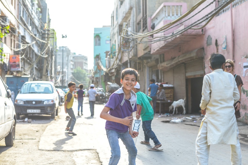 Indian boys playing criсket in Old Delhi, India